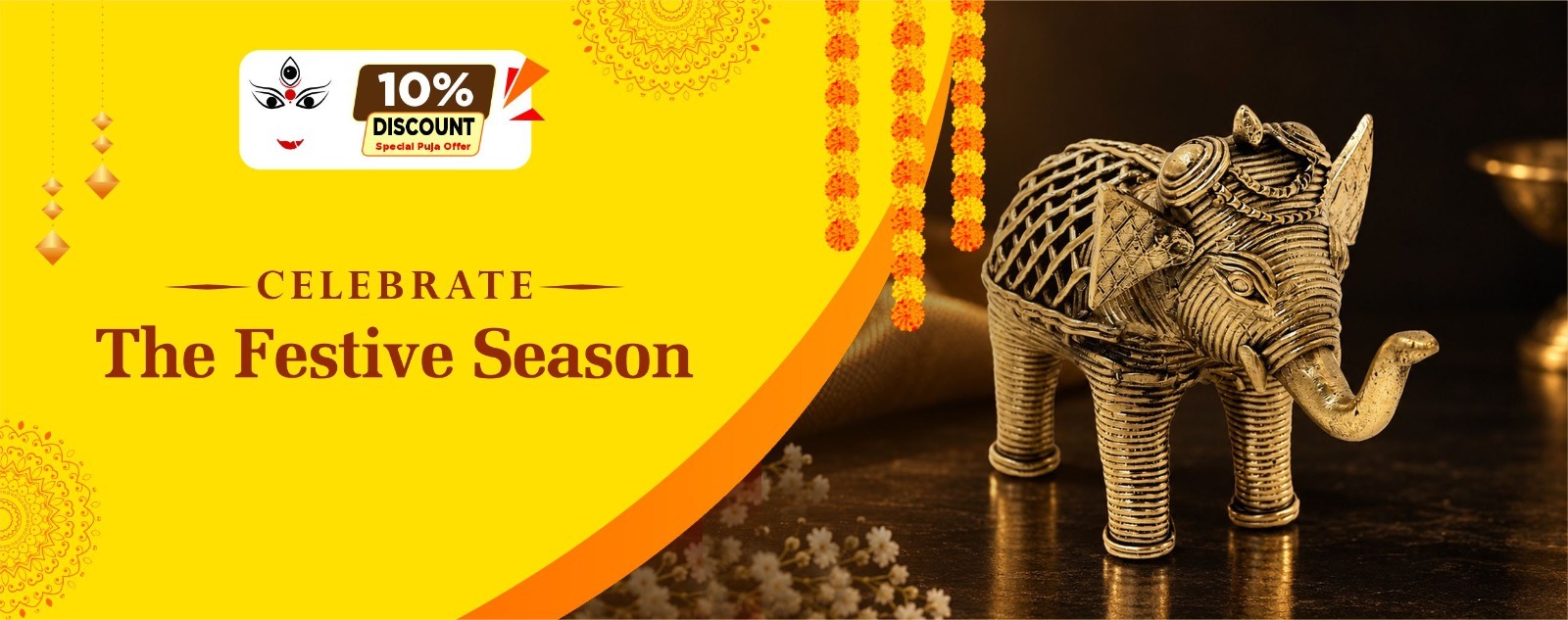 Brass-toned Dhokra elephant sculpture in a festive setting